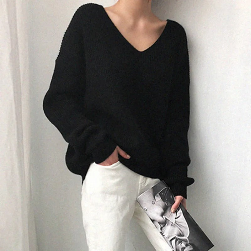 Black V-neck knit sweater with long sleeves and relaxed drape