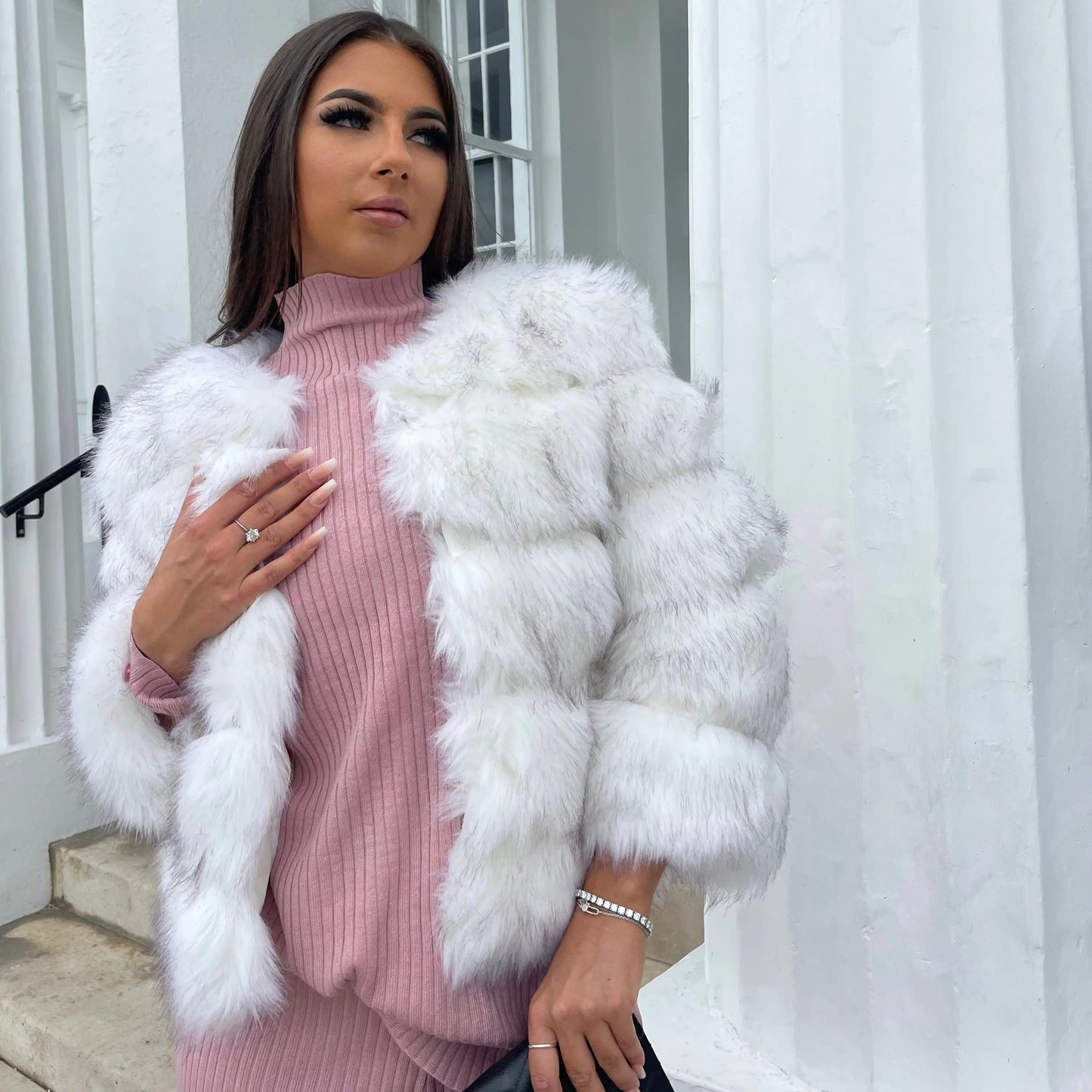 Women's white faux fur jacket with oversized collar and ribbed inner trim