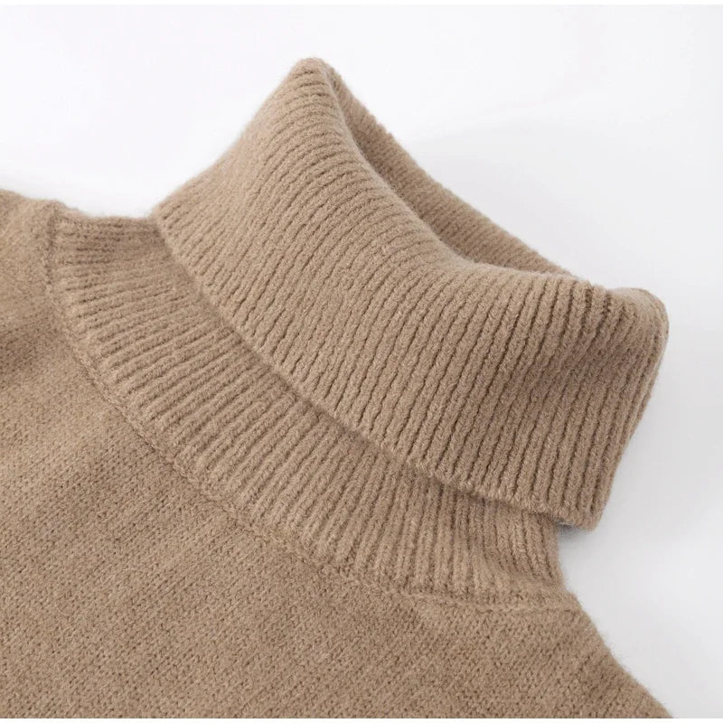 Ribbed turtleneck sweater neckline close-up in camel beige, fold-over collar knit