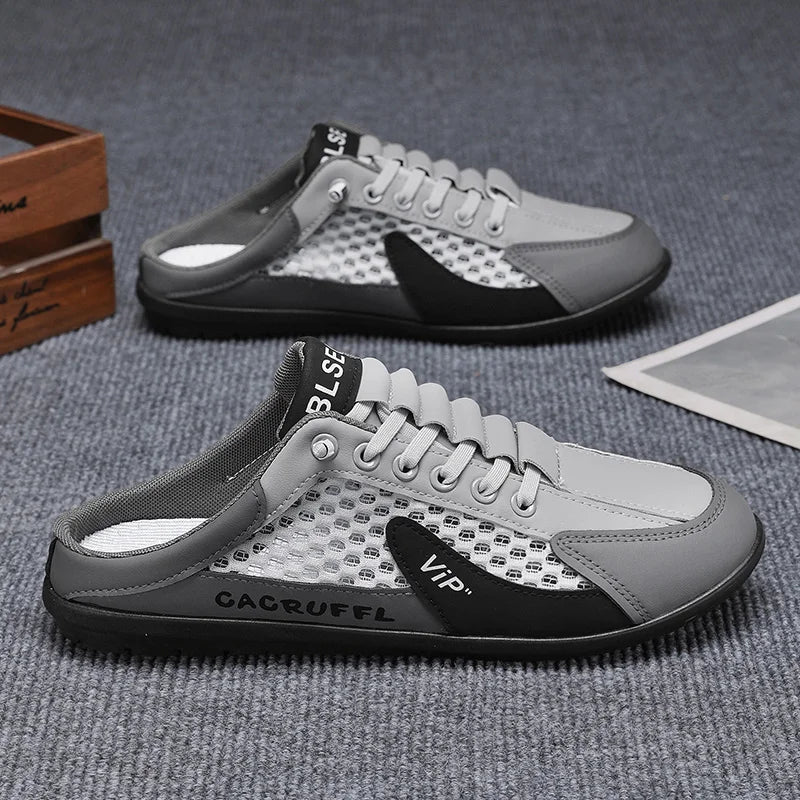 Men's mesh slip-on loafer shoes, light gray with black paneling, closed toe.