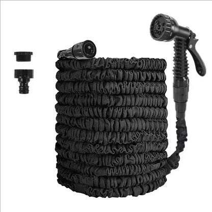 Expandable garden hose with black spray gun, black coiled hose, and two connectors