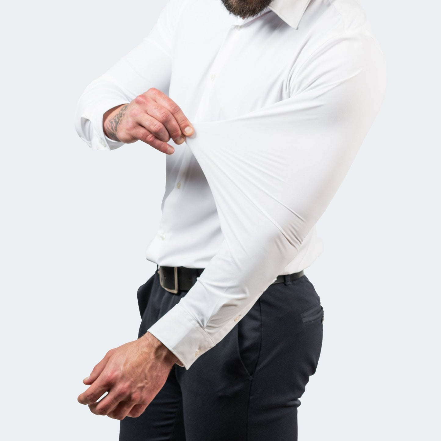 Men's white long-sleeve button-up shirt with spread collar and button cuffs