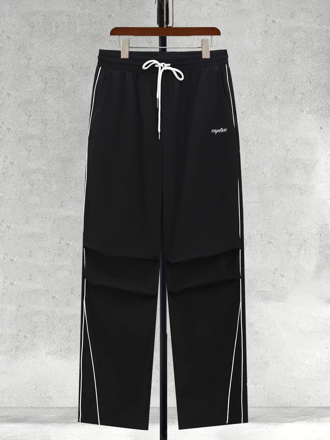 Men's black wide-leg trousers with white side stripe and drawstring waist