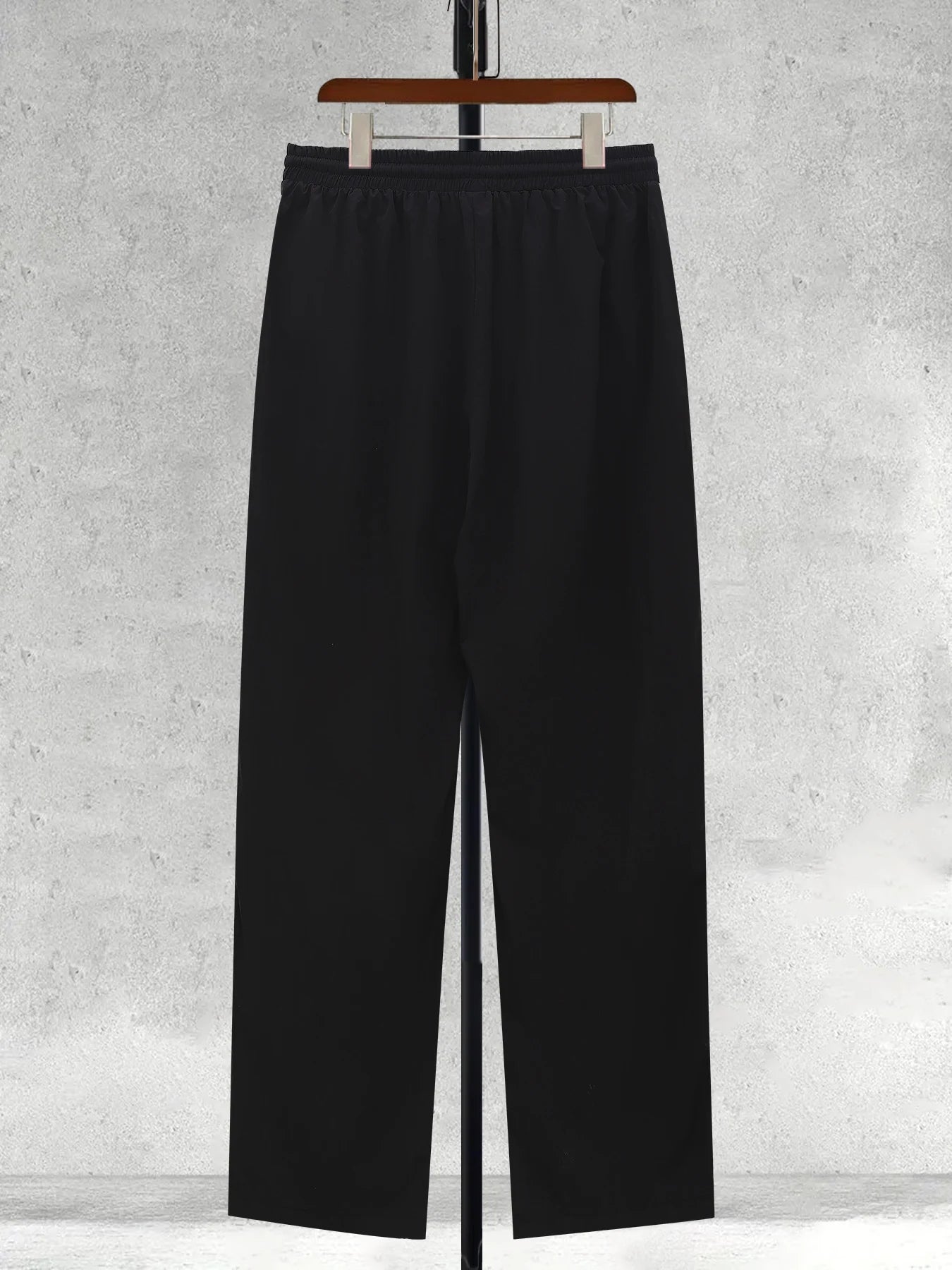 Men's black wide-leg trousers with elastic waistband and straight wide legs