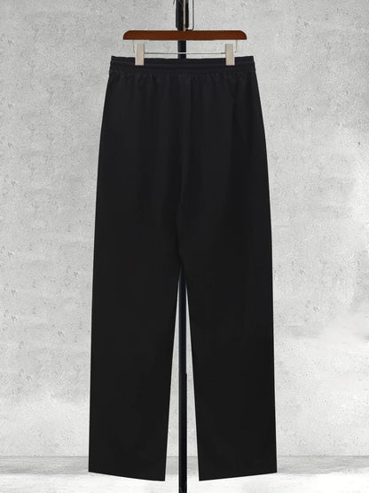 Men's black wide-leg trousers with elastic waistband and straight wide legs