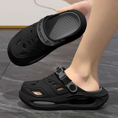 Black anti-slip clogs with thick sole, vented upper, and adjustable strap