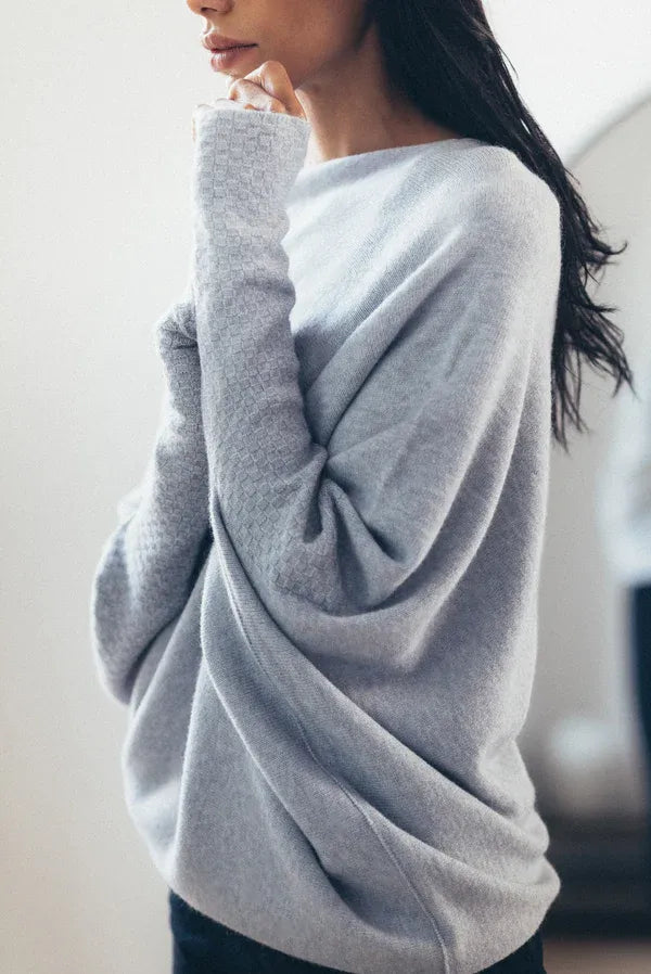 Grey asymmetric draped sweater with twisted front, boat neckline, long sleeves
