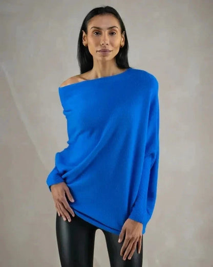 Bright blue asymmetric draped sweater with one-shoulder neckline, long sleeves