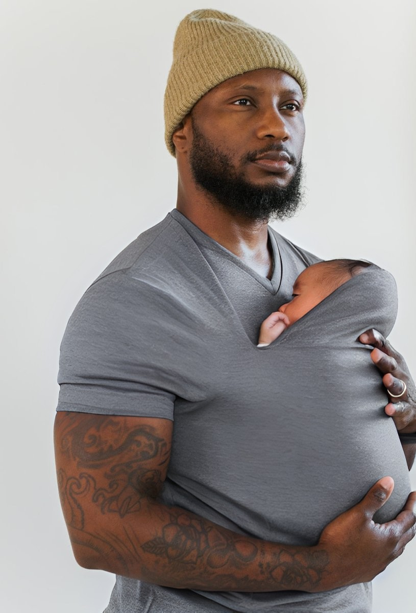 Heather gray baby carrier sling T-shirt with short sleeves and wrap carrier, holding baby.
