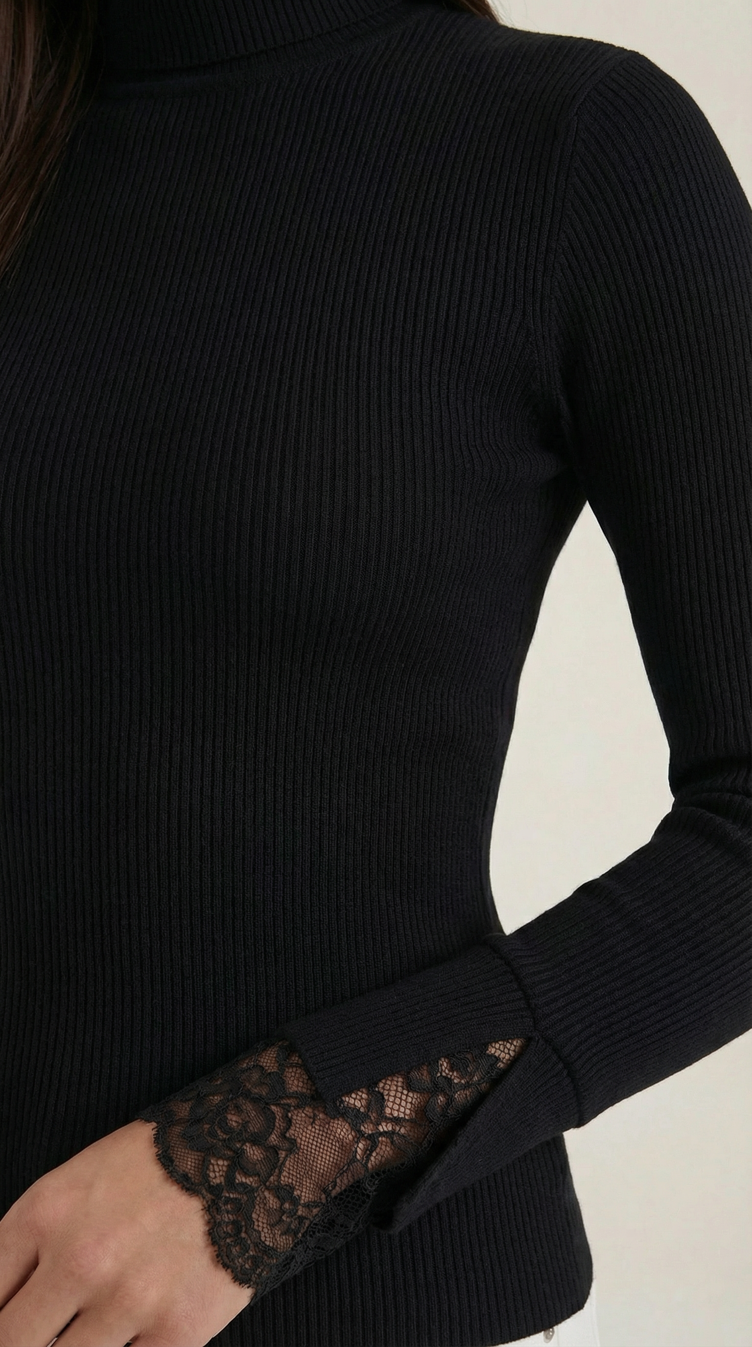 Black ribbed turtleneck cuff with lace panel on sleeve