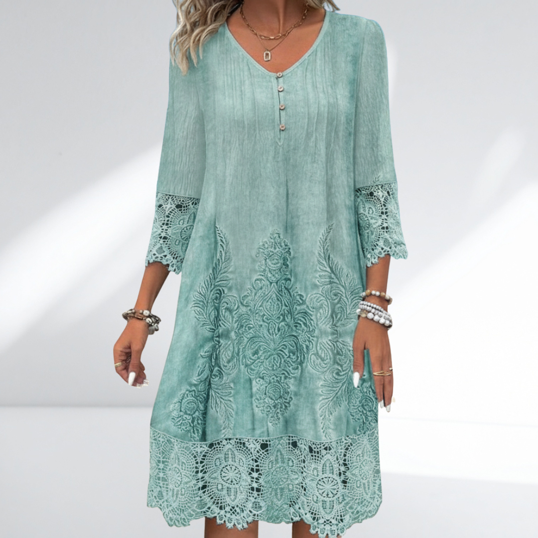 Embroidered lace tunic dress in teal green with buttoned V neckline and lace hem