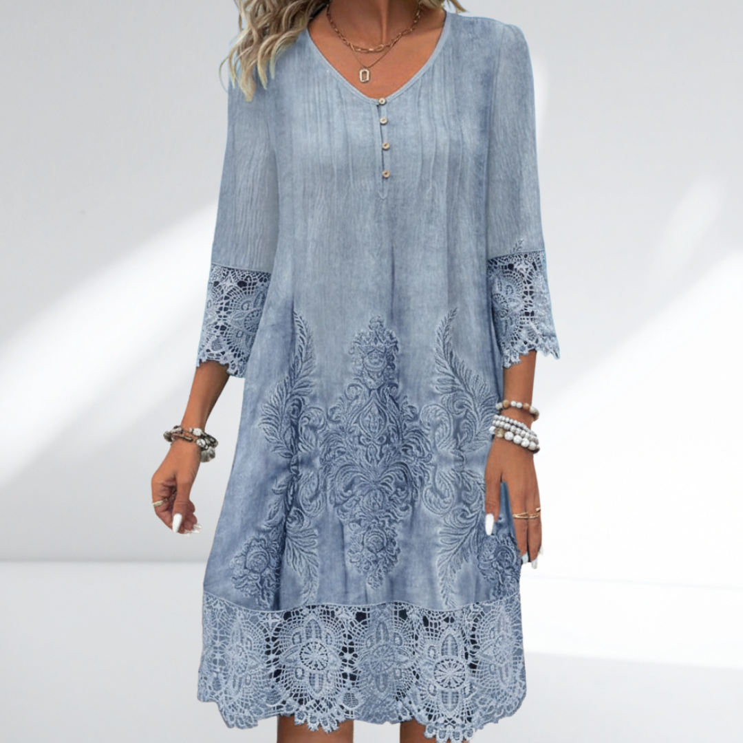 Embroidered lace tunic dress in blue with buttoned V neckline and lace cuff detail