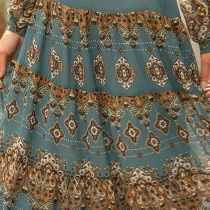 Bohemian dress fabric close-up in teal with repeating diamond medallion print