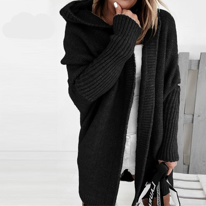 Black hooded knit cardigan with long sleeves and ribbed pocket openings