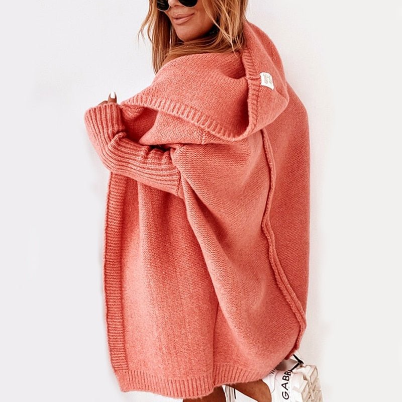 Coral hooded knit cardigan with long sleeves and ribbed cuffs