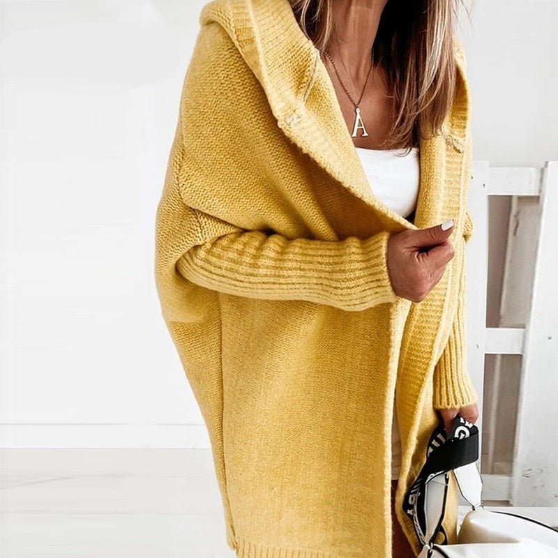 Mustard yellow hooded knit cardigan with long sleeves and ribbed cuffs