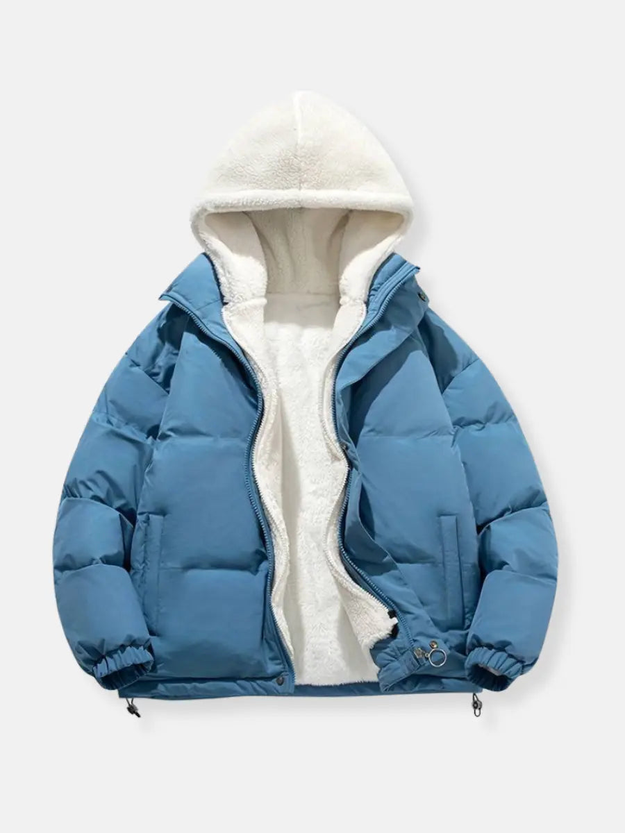 Blue puffer winter jacket with white sherpa hood, full-zip, and zip pockets