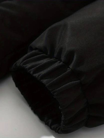 Women’s warm zip-up winter jacket sleeve detail, black padded fabric