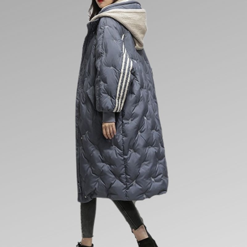 Women’s long dark blue puffer jacket with striped sleeves and attached hood