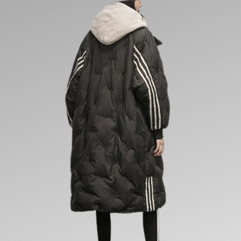 Women’s long black puffer jacket with striped side panels and attached hood