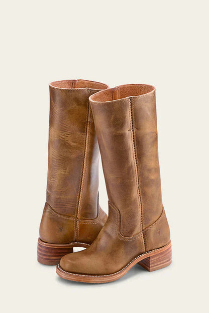 Pair of women’s leather knee-high boots, tan brown with stitched detailing and low heel