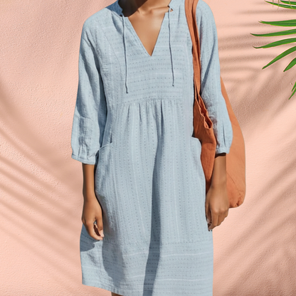 Blue V-neck tunic dress with gathered waist and 3/4 sleeves, loose shift fit