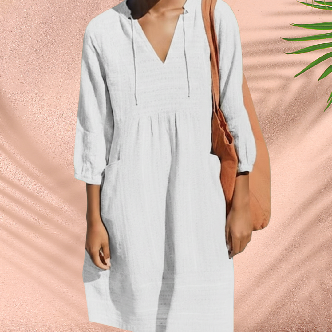 White V-neck tunic dress with gathered waist, textured bodice, 3/4 sleeves