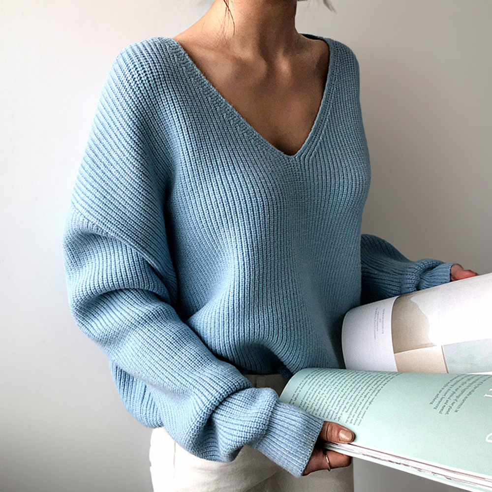 Light blue cozy V-neck knit sweater with long sleeves and ribbed cuffs