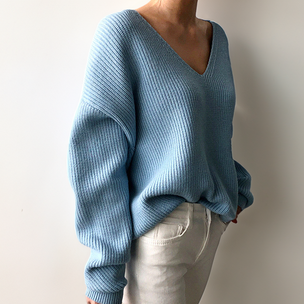 Light blue V-neck knit sweater with relaxed fit, long sleeves, ribbed hem