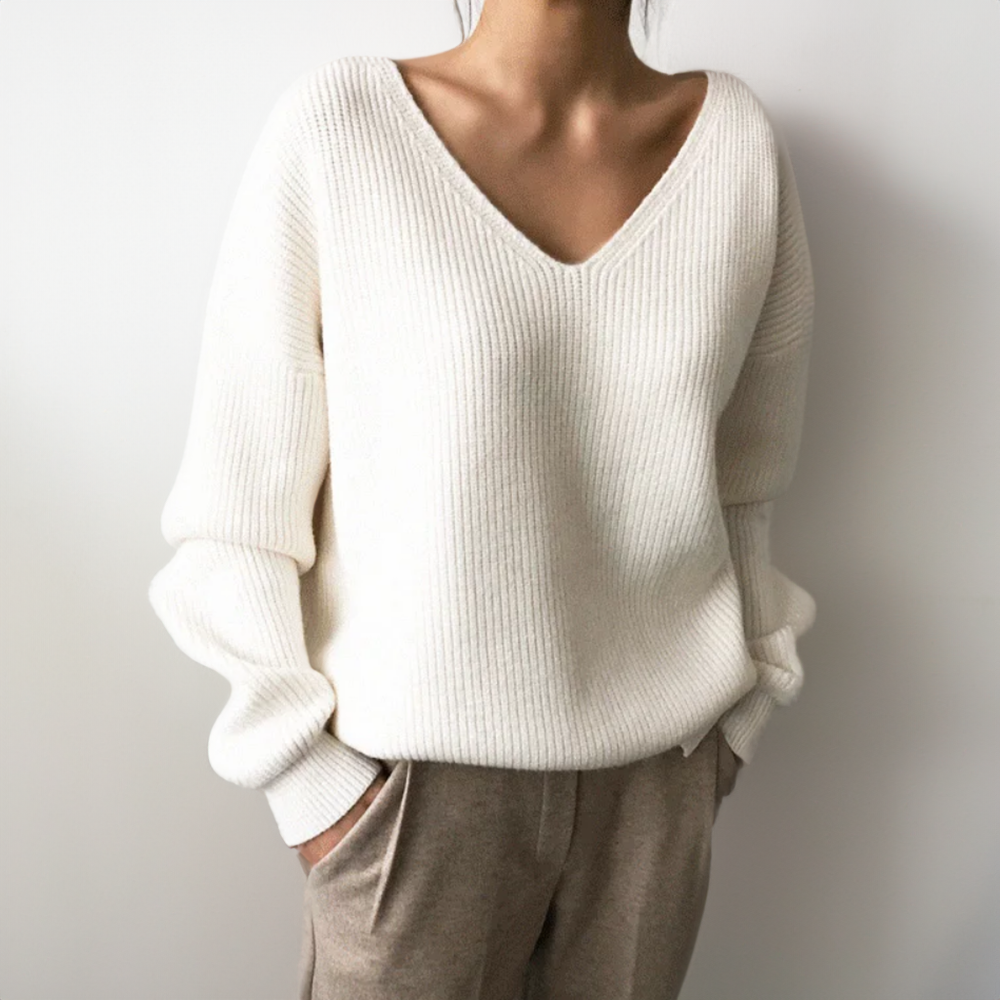 White V-neck knit sweater with long sleeves, ribbed cuffs and hem