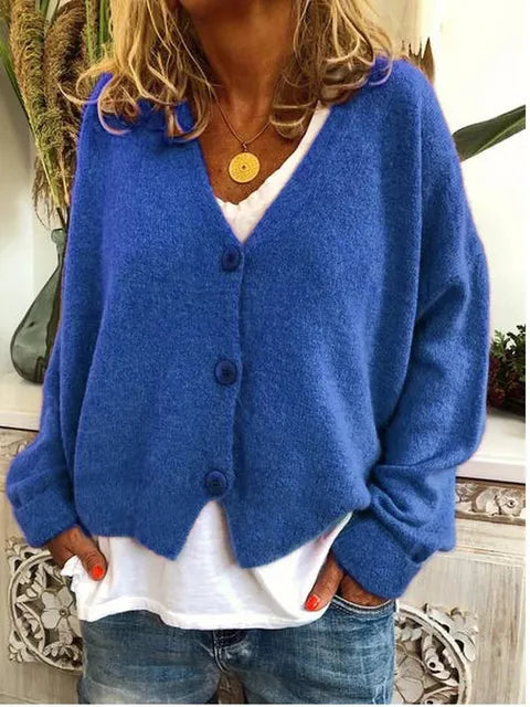 Blue cotton button front jacket with long sleeves and V-neck center button closure