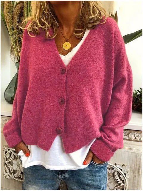 Pink cotton button front jacket with long sleeves and V-neck center button closure
