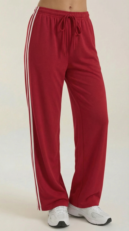 Red wide-leg track pants with elastic drawstring waist and white side stripe accents