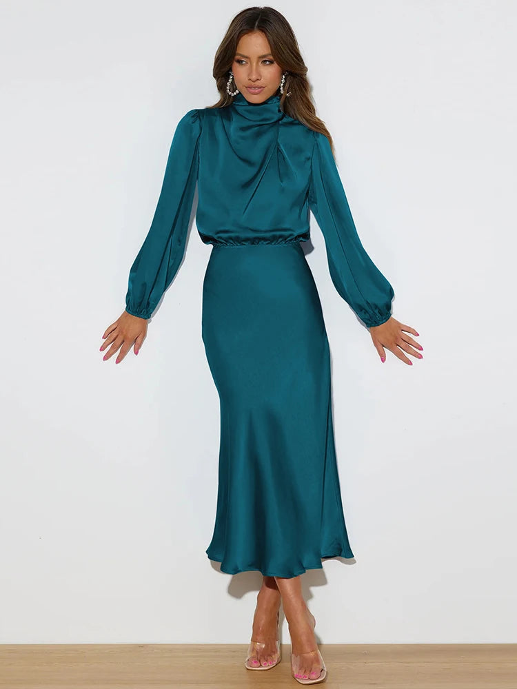Teal satin cowl-neck midi dress with long sleeves and draped fitted waist