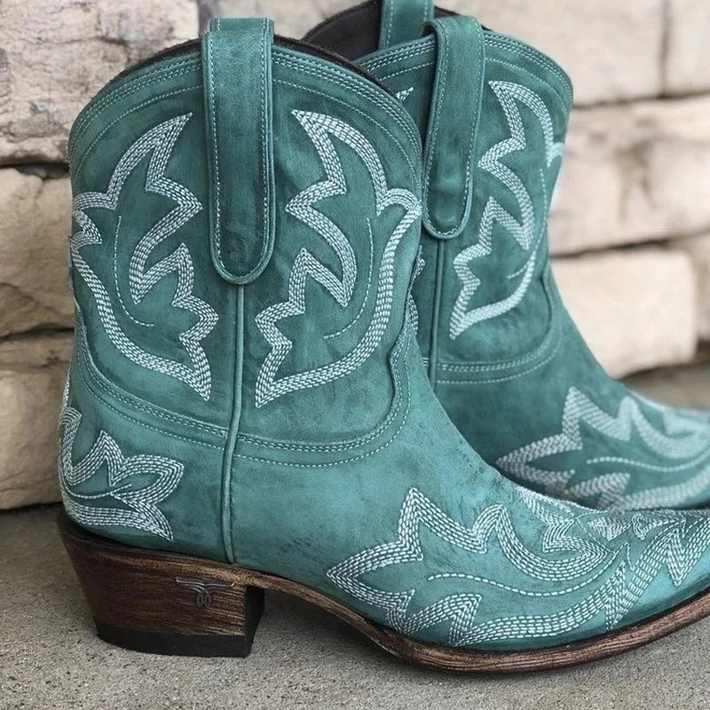 Green women's cowboy boots with white western embroidery, pull-on, medium block heel.