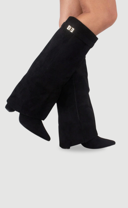 Black suede knee-high boots with square buckle detail at the ankle cuff