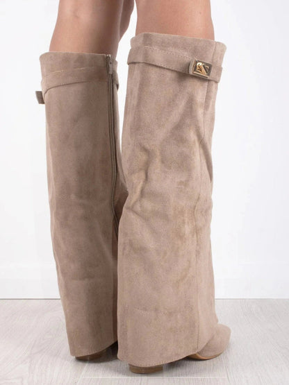 Beige suede knee-high boots with square buckle strap and thick block heel, side view