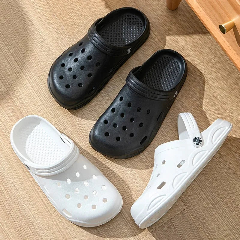 Black and white unisex garden clogs, slip-on sandals with ventilation holes and tread