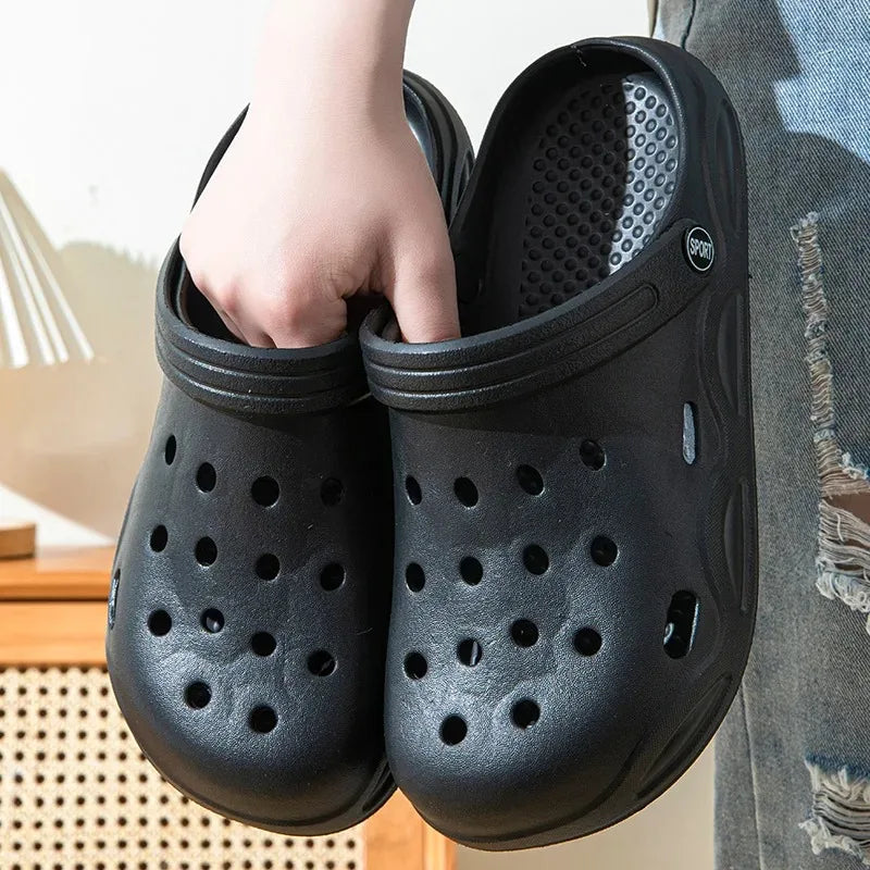 Black unisex garden clogs, slip-on with perforated ventilation holes and molded sole