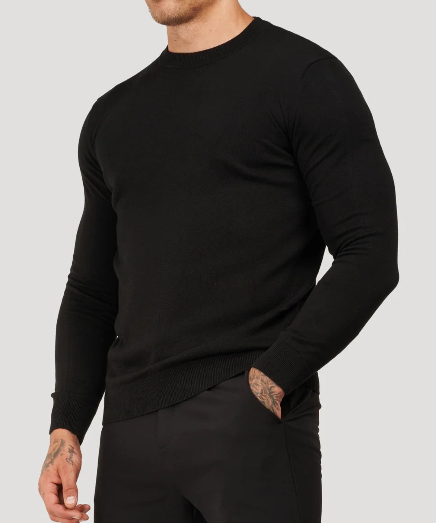 Black fine-knit roll-neck sweater, long sleeves, side view