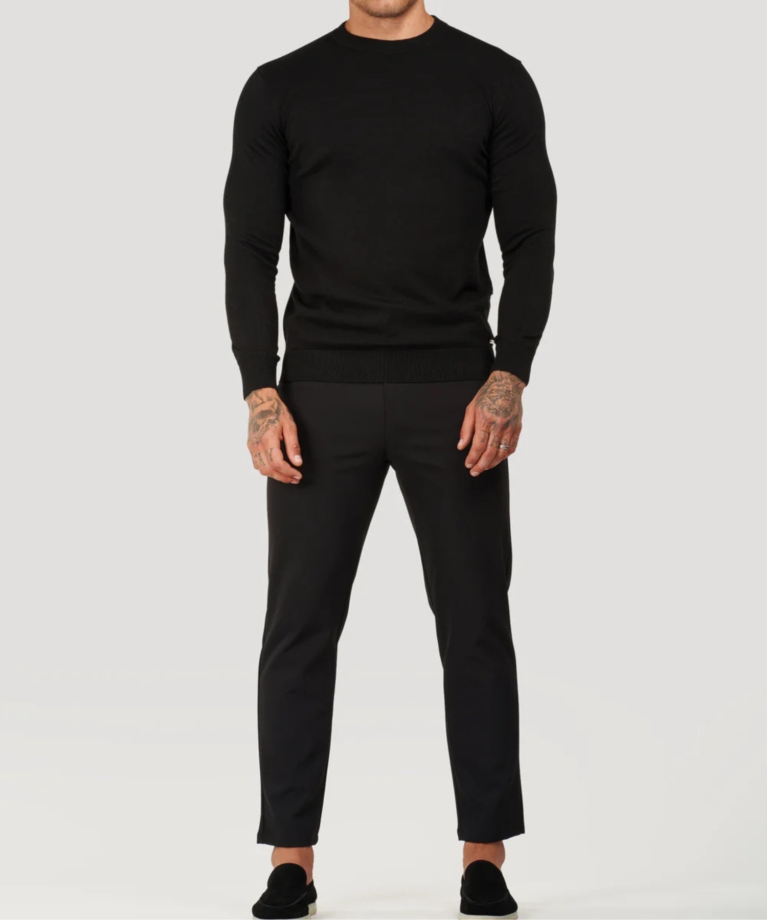 Black fine-knit roll-neck sweater, full front view with long sleeves