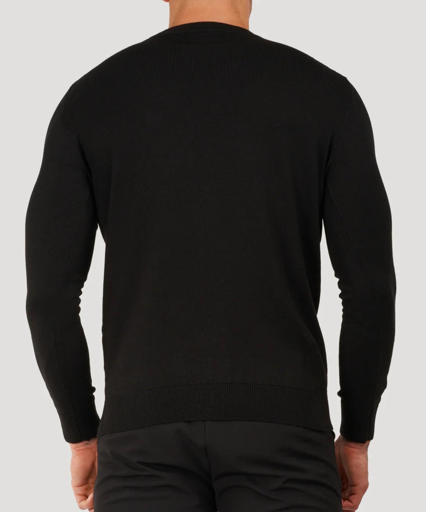Black fine-knit roll-neck sweater, back view