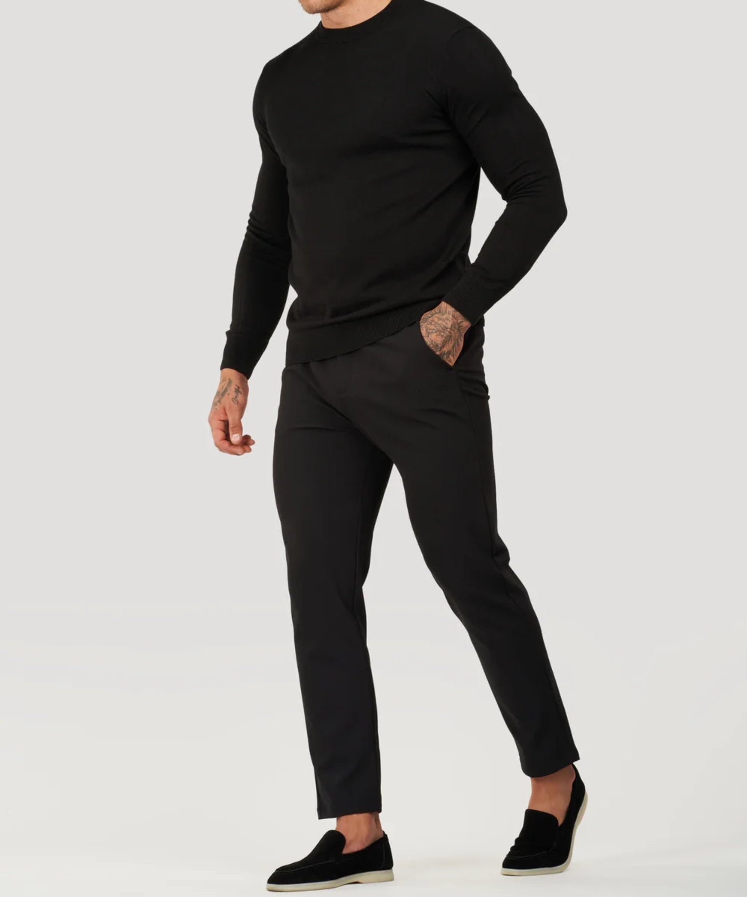 Black fine-knit roll-neck sweater with long sleeves and ribbed cuffs