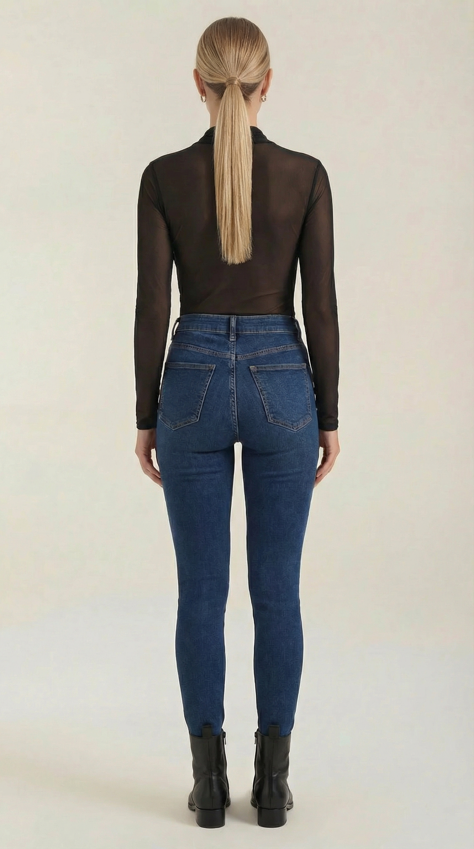 Black sheer wrap mesh top, back view with long sleeves and mesh texture