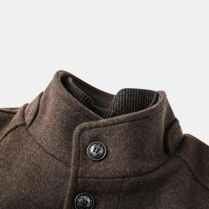 Men's brown stand-collar wool coat detail: button placket and ribbed collar