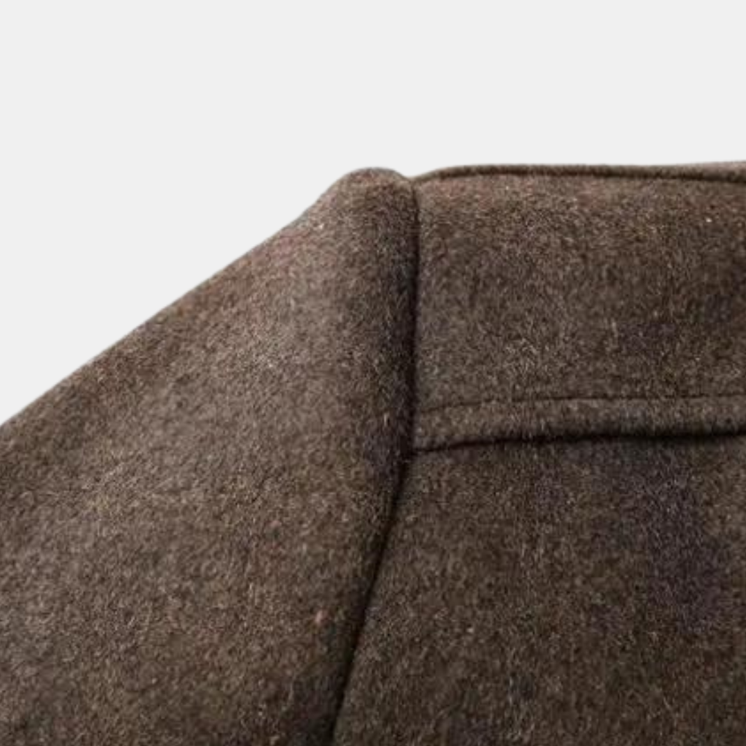 Men's brown wool coat close-up of shoulder and upper seam