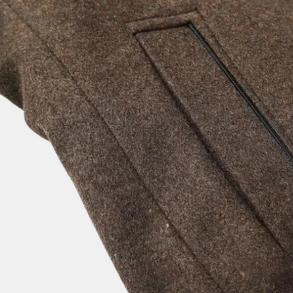 Men's brown wool coat close-up of side panel and stitched seam