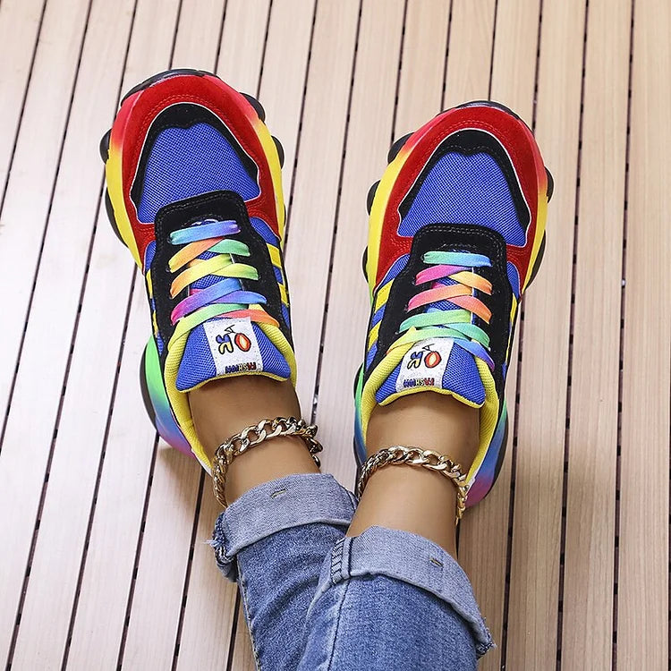 Multicolor lace-up chunky sneakers with rainbow detailing on blue textile uppers