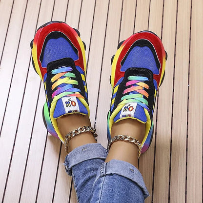 Multicolor lace-up chunky sneakers with rainbow detailing on blue textile uppers