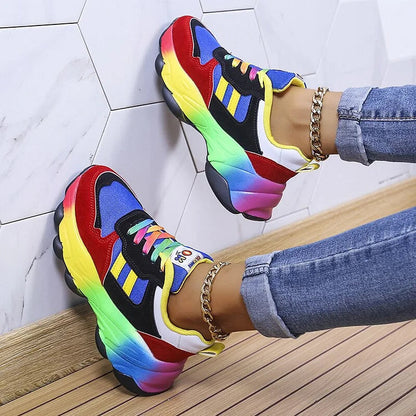 Multicolor lace-up chunky sneakers with blue, red, and yellow uppers and rainbow soles